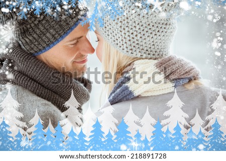 Composite image of couple in warm clothing facing each other against snow