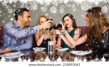 Composite image of a Happy friends drinking red wine in a bar against twinkling stars
