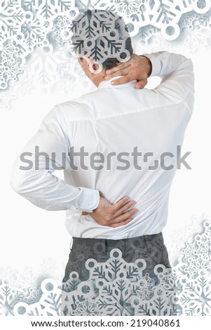 Portrait of the painful back of a businessman against snowflakes on silver