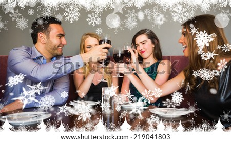 Composite image of a Happy friends drinking red wine in a bar against snow