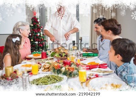Extended family at dining table for christmas dinner in house against fir tree forest and snowflakes