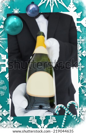 Open bottle of champagne against christmas frame
