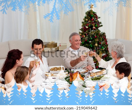 Grandparents and parents toasting in a Christmas dinner against frost and fir trees