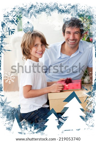 Smiling father and his son opening Christmas presents against christmas themed frame