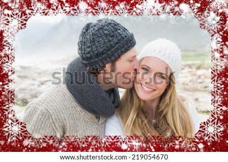 Composite image of snow frame against man kissing a woman on rocky landscape