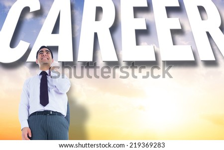 Smiling businessman standing against beautiful orange and blue sky with text