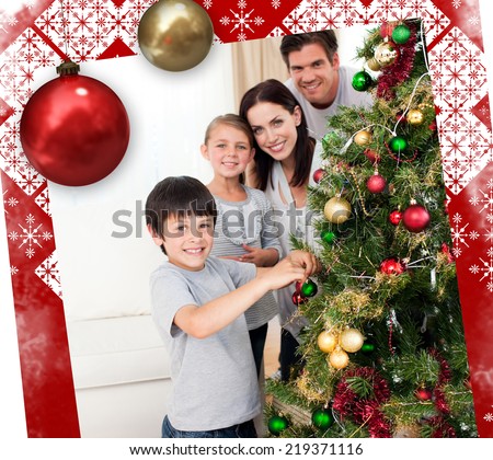 Smiling family decorating a Christmas tree against christmas themed page