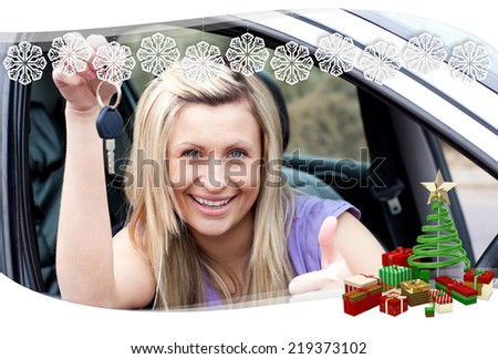 Charming female driver showing a key after bying a new car against snowflake frame