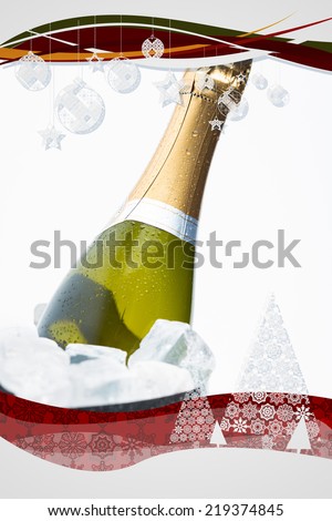 Composite image of christmas frame against champagne cooling in ice bucket