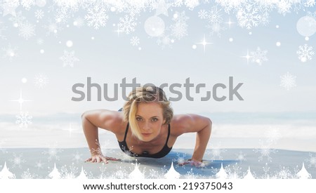 Composite image of a Fit blonde in plank position on the beach against twinkling stars