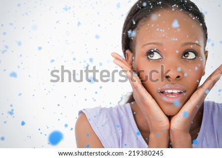Close up of woman being afraid on white background against snow falling
