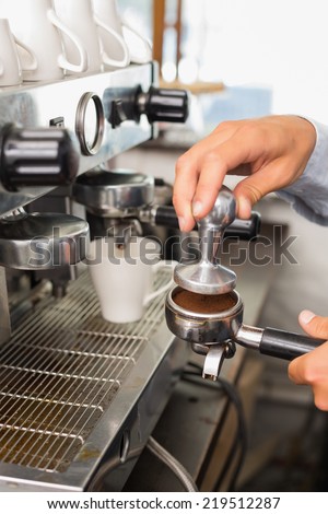 Barista making a cup of coffee at the coffee shop