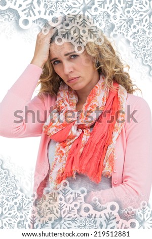 Woman having both headache and belly pain against snowflakes on silver