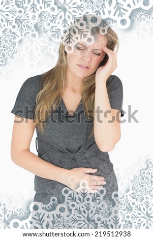 Composite image of sick woman feeling bad against snowflakes on silver