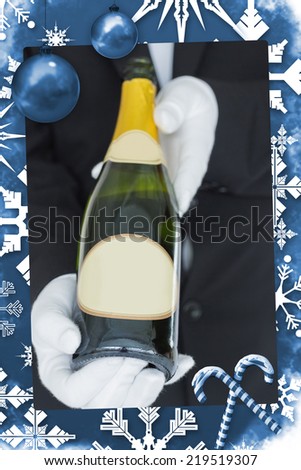 Close view of open bottle of champagne against christmas frame
