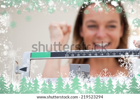 Composite image of scale showing weight loss against snow