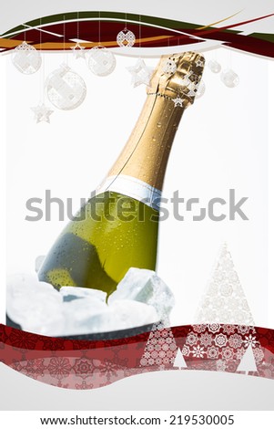 Christmas frame against champagne cooling in ice bucket