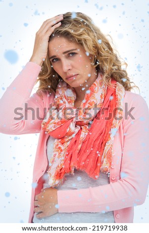 Woman having both headache and belly pain against snow falling