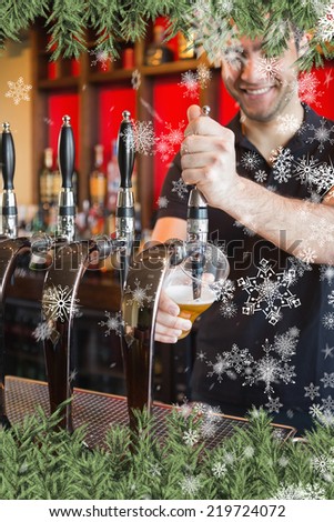 Composite image of a Handsome barkeeper pulling a pint of beer against snow falling