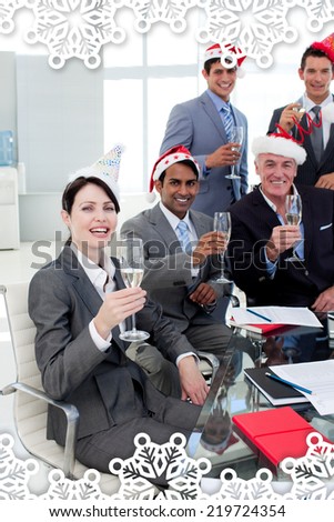 Manager and his team with novelty Christmas hat toasting at a party against snowflake frame