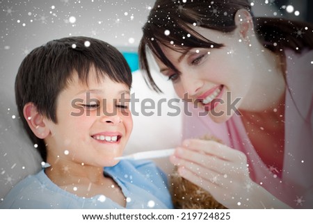 Composite image of positive nurse and his patient looking at a thermometer against snow