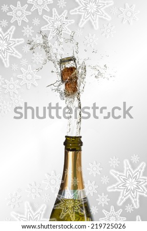 Composite image of snowflakes on silver against champagne cork popping