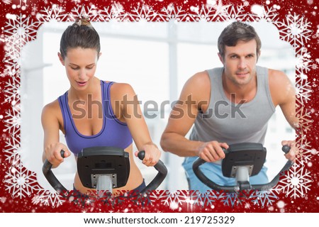 Composite image of snow frame against fitness class in gym