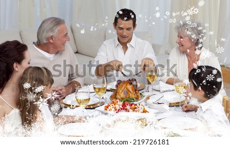 Composite image of a Father serving turkey to his family in a dinner against snow