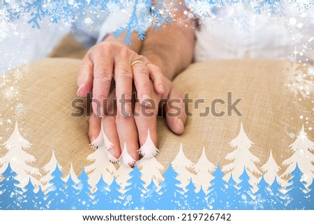 Composite image of snow frame against retired couple holding hands