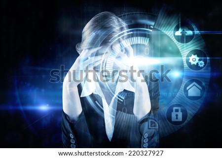 Redhead businesswoman with head in hands against black technology interface with glow