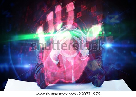Businessman with head in hands against red technology hand print design