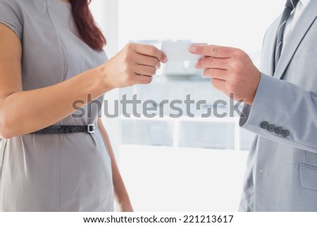 Business man giving his card to customer