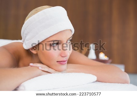 Close up of a beautiful young woman with towel wrapped on head