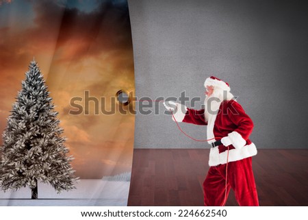 Santa pulls something with a rope against dark room with floorboards