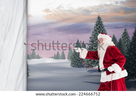 Santa pulls something with a rope against snowy landscape with fir trees
