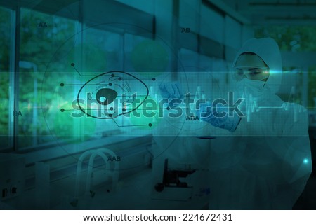 Scientist in protective suit working with green cell diagram interface against ecg line in blue and black