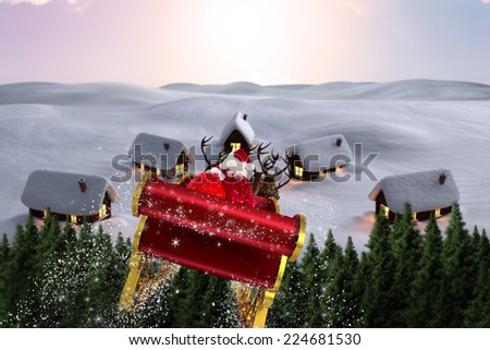 Santa flying his sleigh against digitally generated snowy land scape
