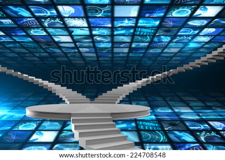 Winding stairs against walls of digital screens in blue
