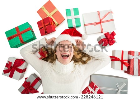 Woman laying on the floor with gifts around her on white background