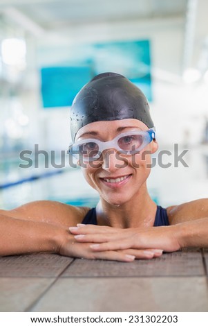 Close up portrait of a fit female swimmer in the pool at leisure center