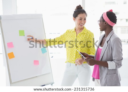 Young creative women brainstorming together in creative office