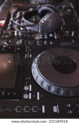 Sound mixer of DJ turntable at the nightclub