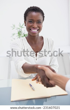 Smiling businesswoman introduced her new colleague in the office