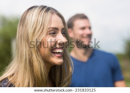 Cute couple smiling and laughing at home in the garden