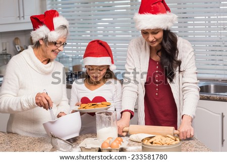 Multi-generation family baking together at home in the kitchen