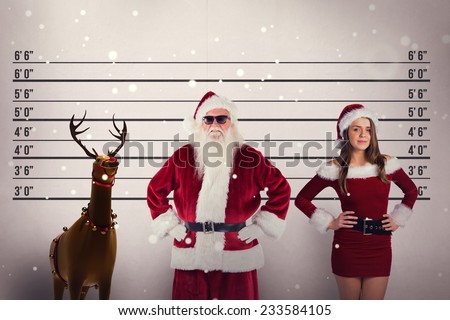 Santa Claus wears black sunglasses against mug shot background