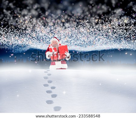 Santa carrying gifts in the snow against bright stars of energy over landscape