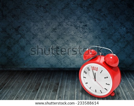 2015 in red alarm clock against dark grimy room