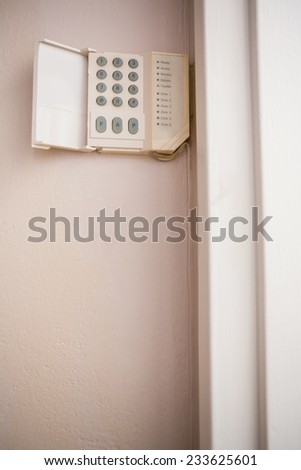 Close up of home security keypad on the wall