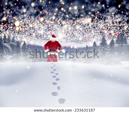 Santa walking in the snow against bright stars of energy over landscape